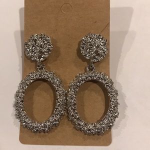 Oval Silver colored diamond cut textured earrings
